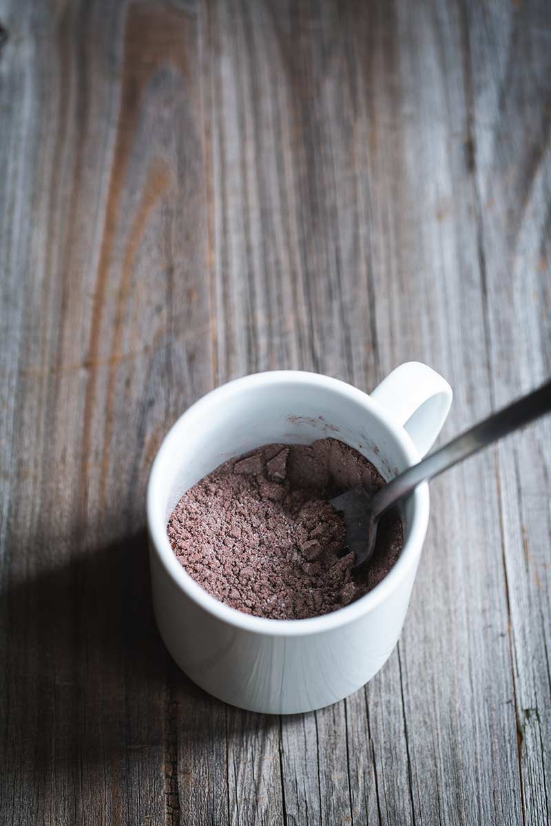 Dry ingredients in a mug mixed together with a fork