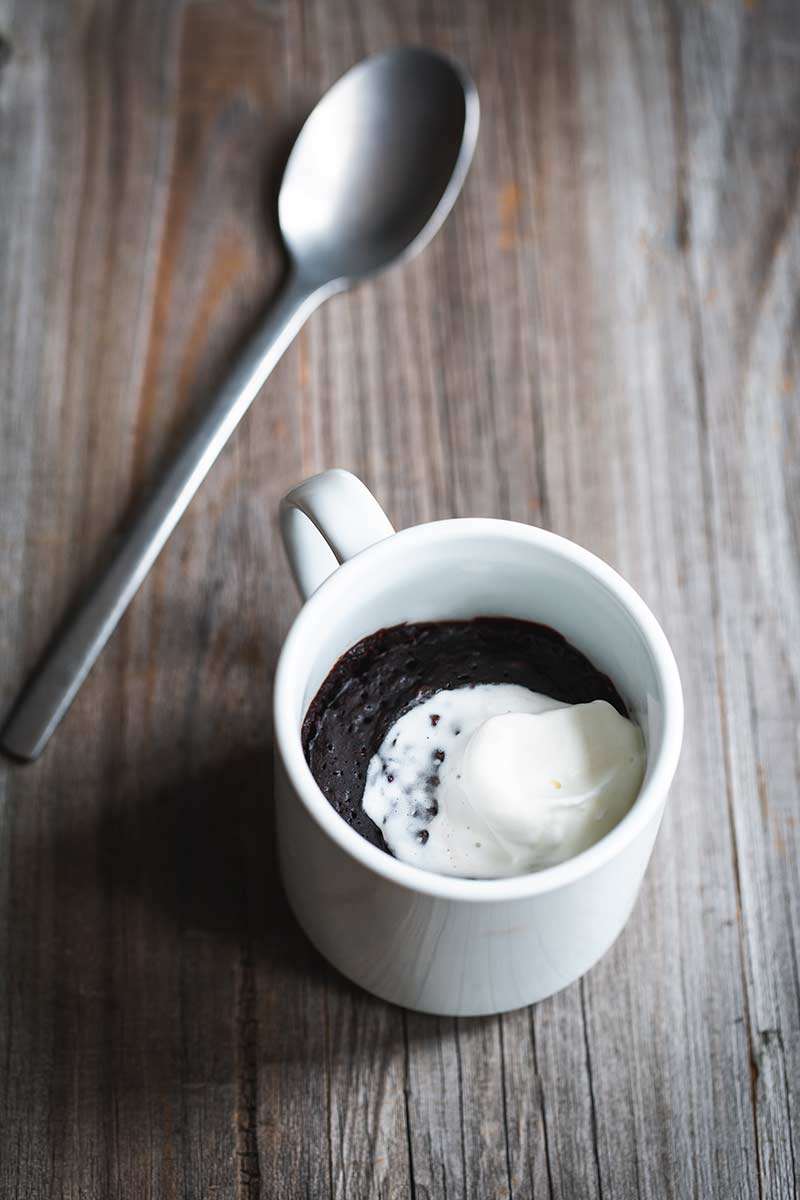 Finished mug brownie topped with whipped cream