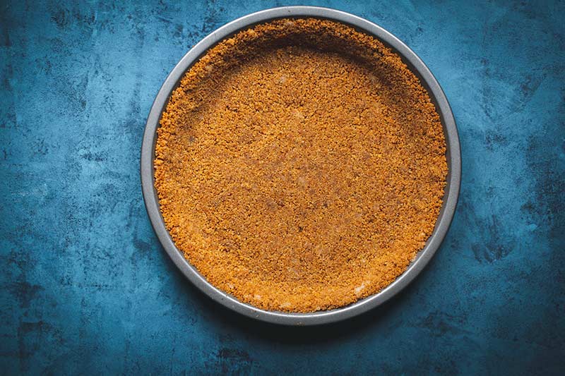 Graham cracker crust baked before pie filling is added