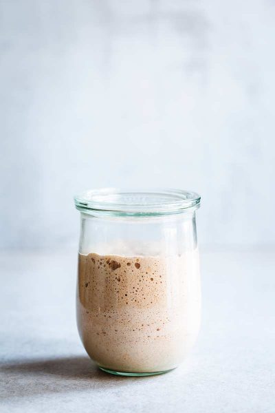 Active sourdough starter in a large mason jar