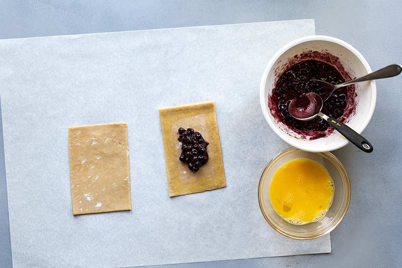Filling scooped into center of a rectangle of tart dough.