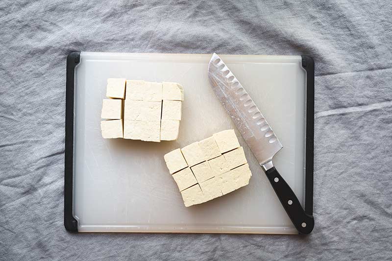 Sliced tofu on a cutting board