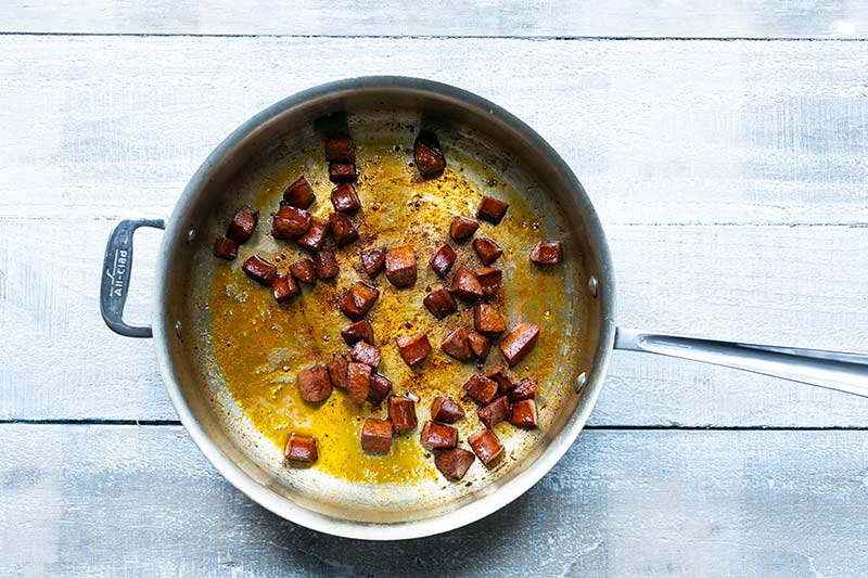 Sausage cooking in a skillet