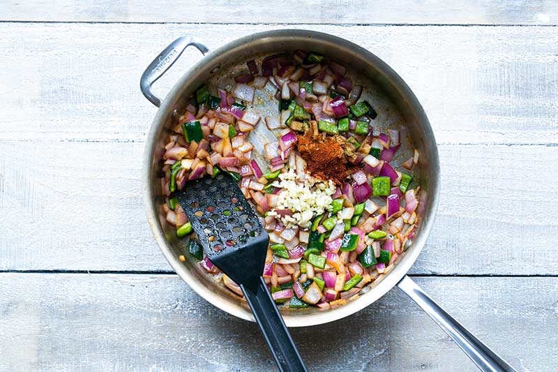 Veggies added to skillet with sausage