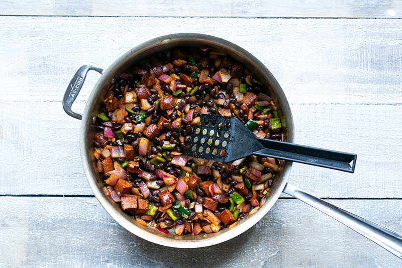 All ingredients for loaded sweet potatoes in skillet