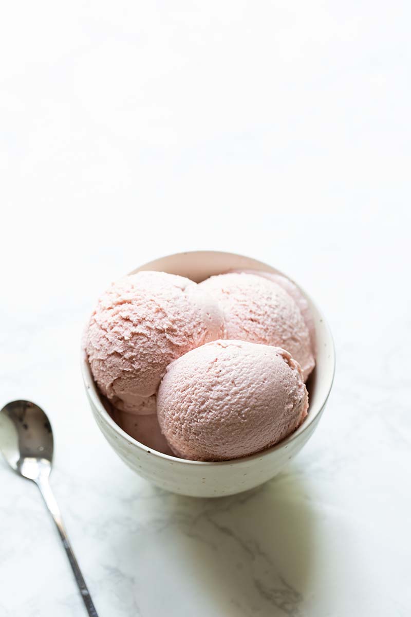 Strawberry rhubarb gelato recipe in a bowl with a spoon