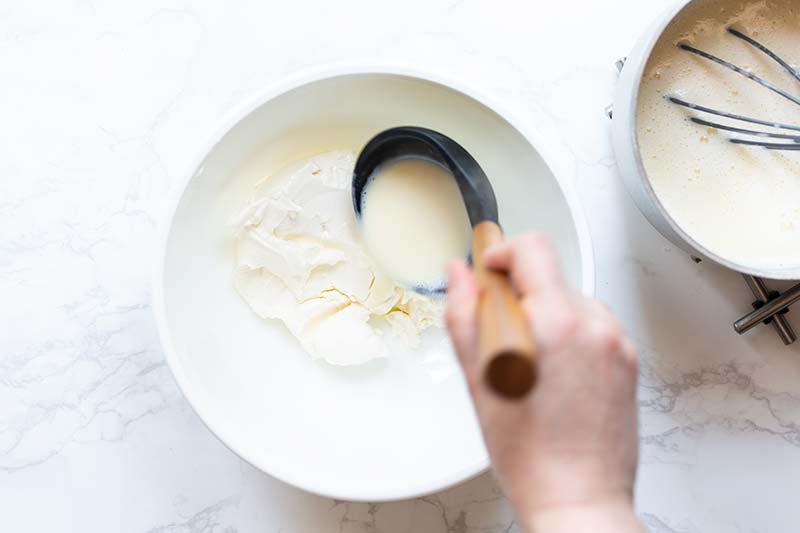 ladling hot gelato base into mascarpone cheese