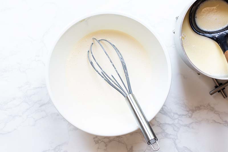 A whisk in smooth mascarpone gelato base